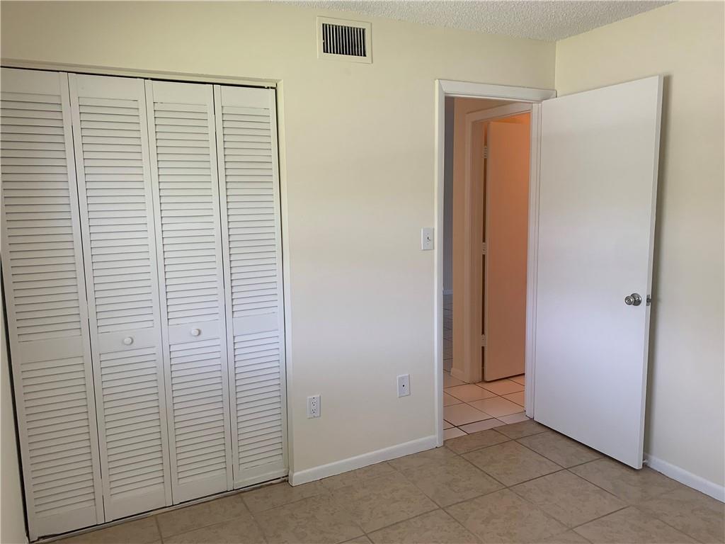 6001 Shaker Wood Circle, Unit 208 Tamarac, FL 33319 - Photo 11 of 13 a view of a room with white door