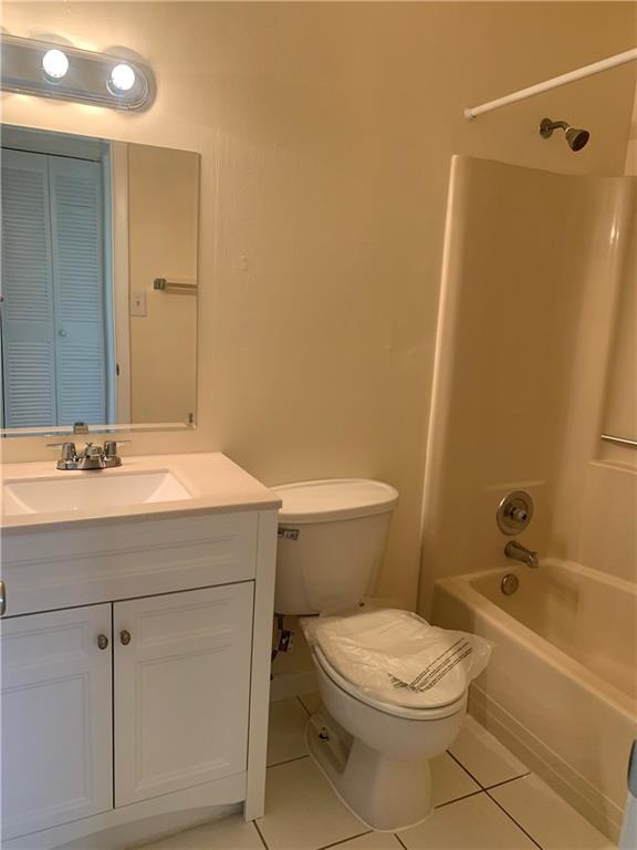 6001 Shaker Wood Circle, Unit 208 Tamarac, FL 33319 - Photo 13 of 13 a bathroom with a sink a toilet and shower