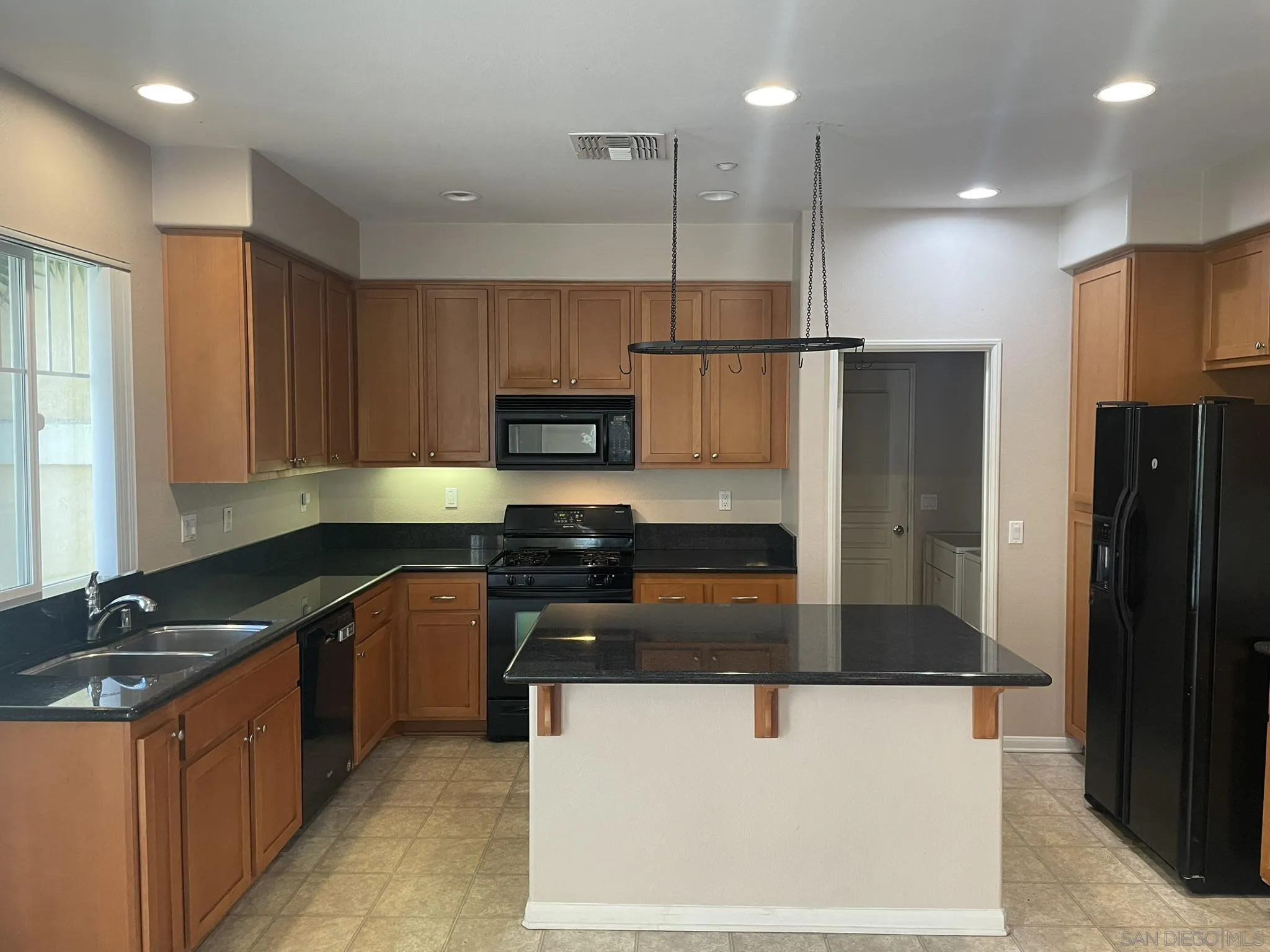 347 Borden Road San Marcos, CA 92069 - Photo 7 of 16 a kitchen with stainless steel appliances granite countertop a refrigerator a sink and a stove