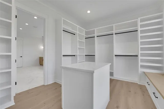 a bathroom with a shower and a glass door