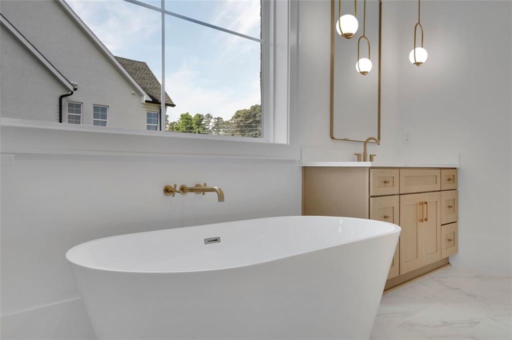 3903 Indian Shoals Road Southeast Bethlehem, GA 30620 - Photo 18 of 35 a white bath tub sitting in a bathroom