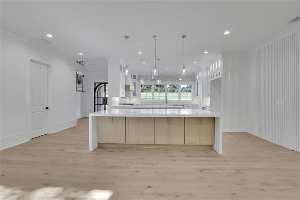 3903 Indian Shoals Road Southeast Bethlehem, GA 30620 - Photo 24 of 35 a kitchen with kitchen island a counter top space appliances and cabinets