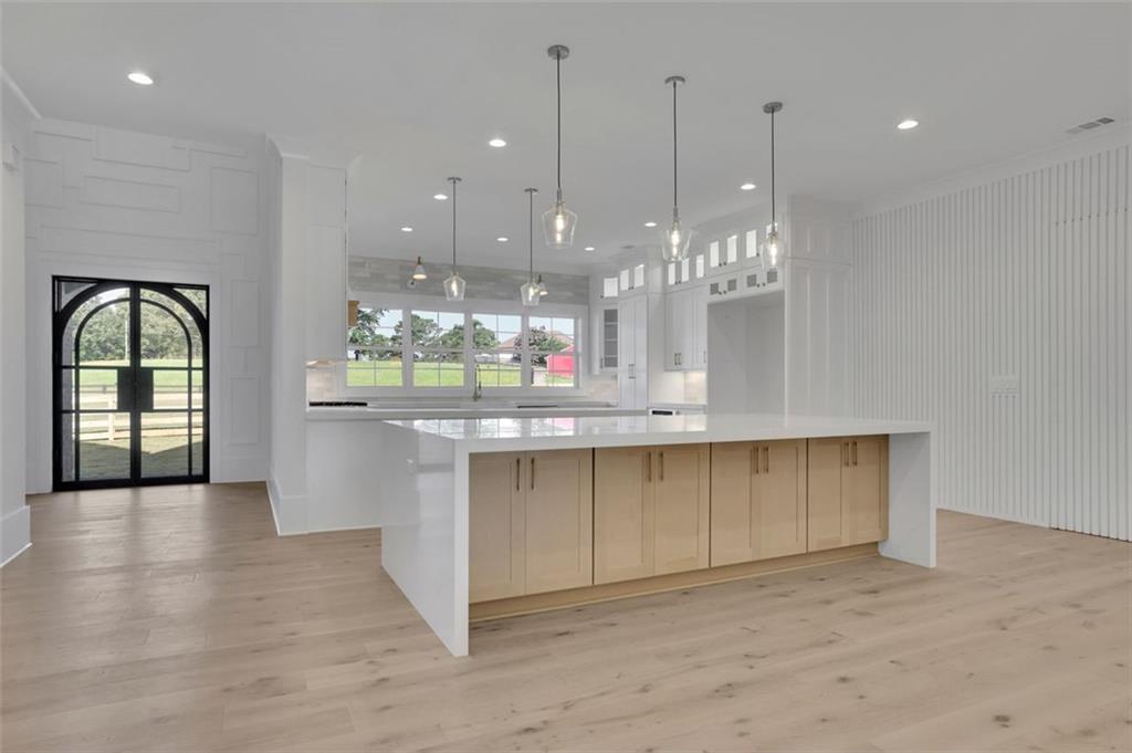 3903 Indian Shoals Road Southeast Bethlehem, GA 30620 - Photo 25 of 35 a view of a room with kitchen and chandelier