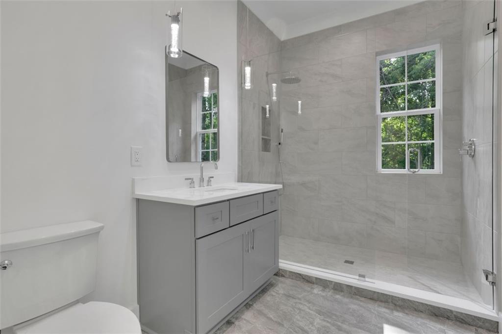 3903 Indian Shoals Road Southeast Bethlehem, GA 30620 - Photo 4 of 35 a bathroom with a sink toilet and shower