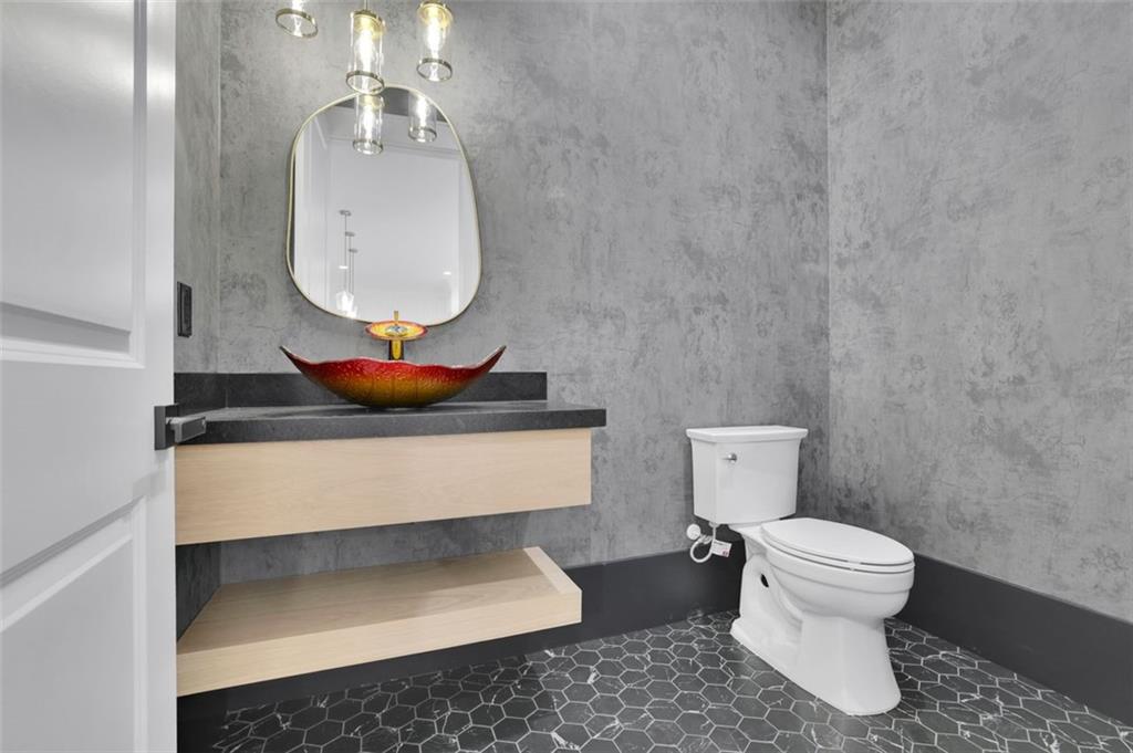 3903 Indian Shoals Road Southeast Bethlehem, GA 30620 - Photo 6 of 35 a bathroom with a toilet and a mirror