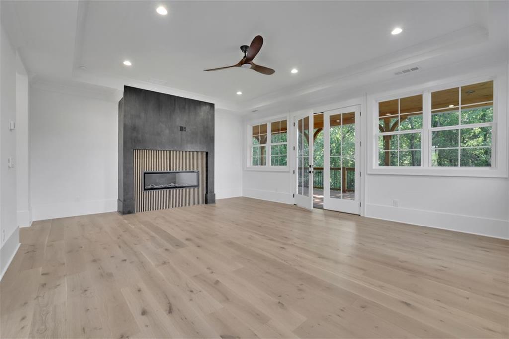 3903 Indian Shoals Road Southeast Bethlehem, GA 30620 - Photo 10 of 35 a view of an empty room with a window and kitchen view