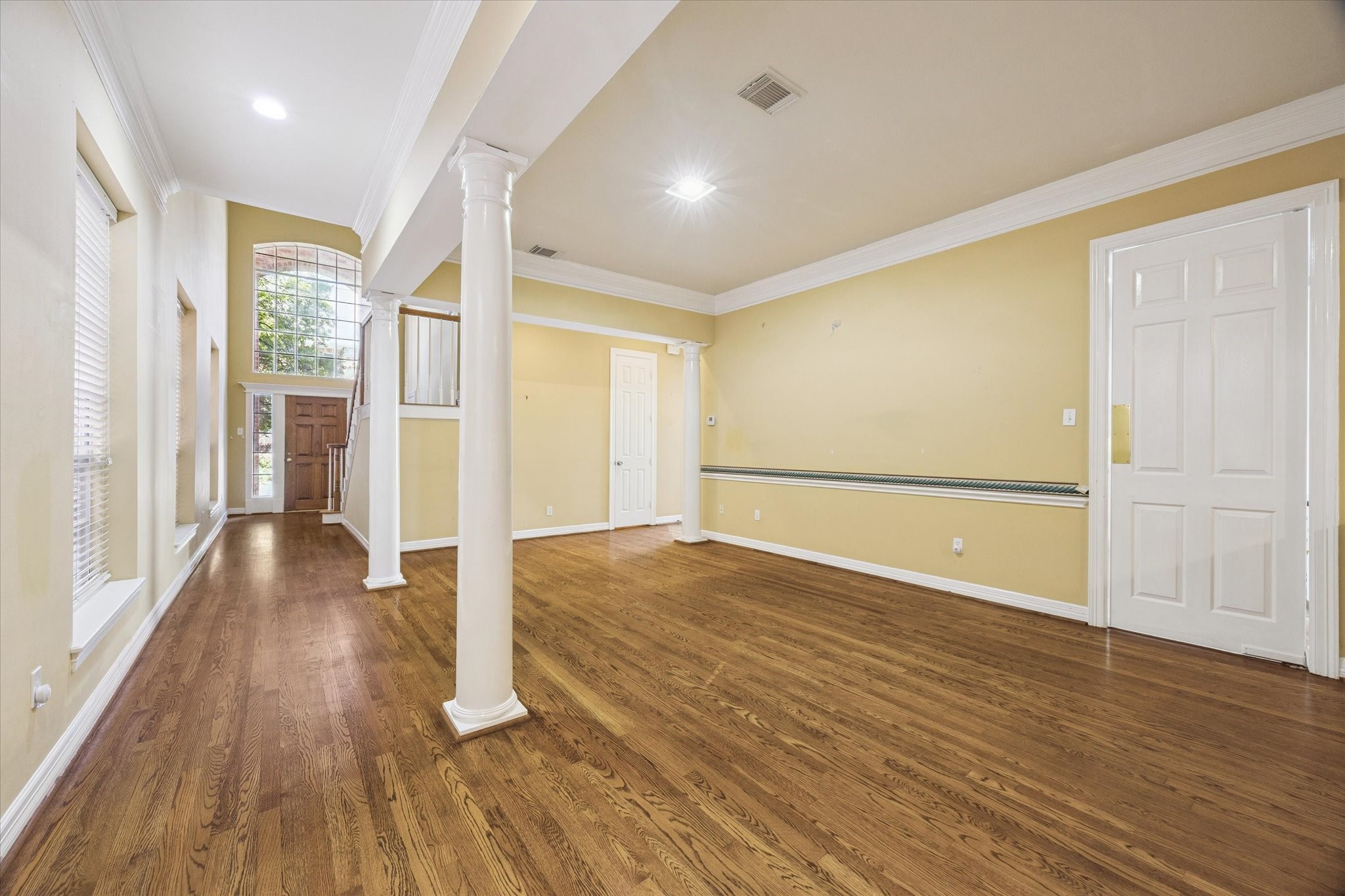 2410 Briar Ridge Drive Houston, TX 77057 - Photo 2 of 12 wooden floor in an empty room with a window