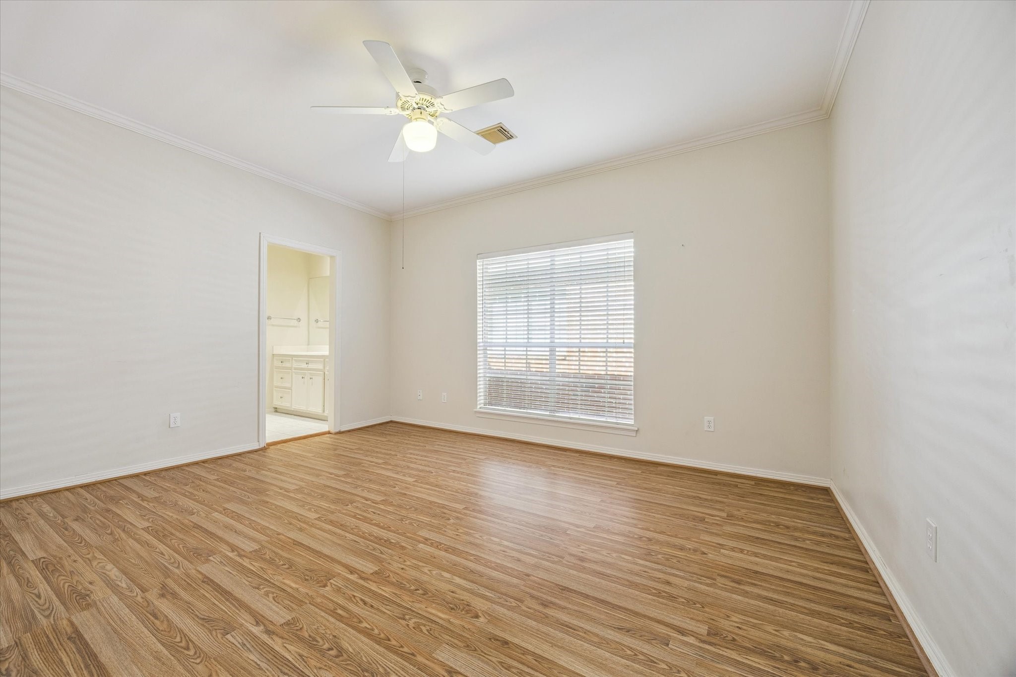 2410 Briar Ridge Drive Houston, TX 77057 - Photo 8 of 12 a view of an empty room with wooden floor and a window