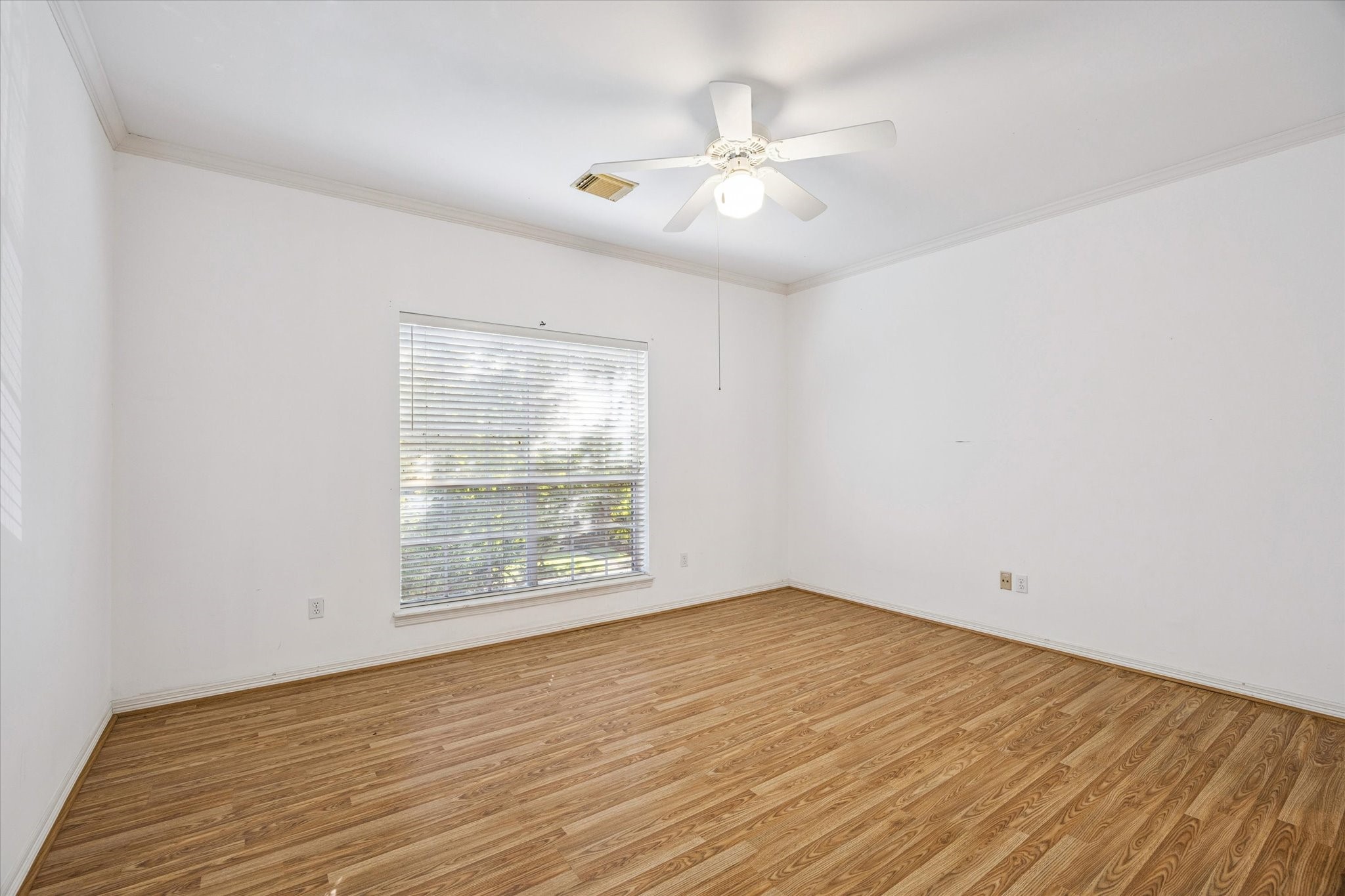 2410 Briar Ridge Drive Houston, TX 77057 - Photo 10 of 12 wooden floor in an empty room with a window