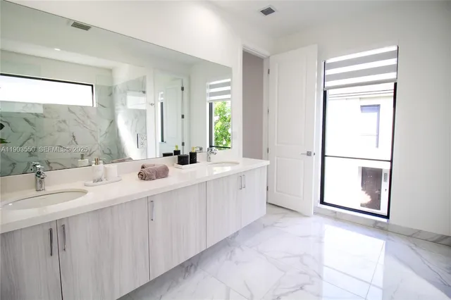 a bedroom with bed and a potted plant