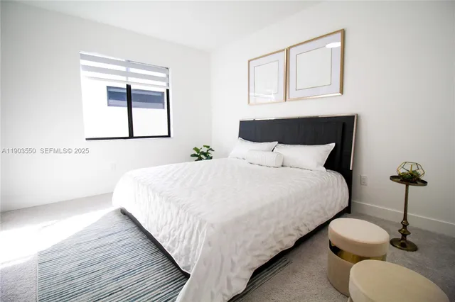 a bathroom with a white toilet sitting next to a bath tub