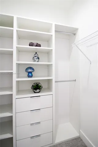a bathroom with a double vanity sink toilet and shower