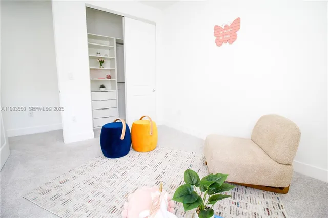 a view of backyard of house with green space