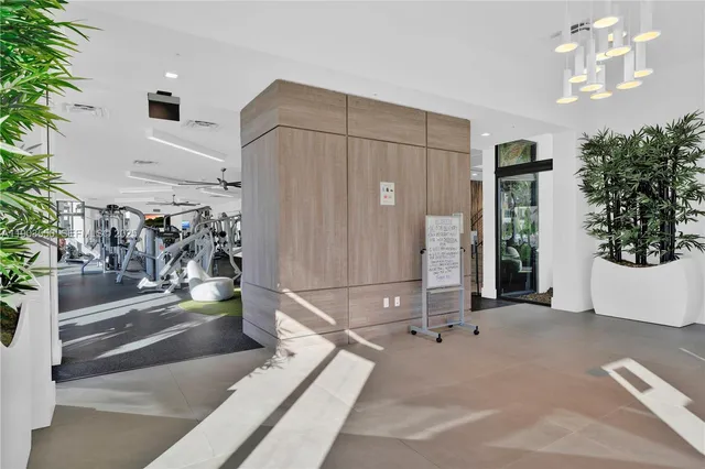 a living room with lots of gym equipment
