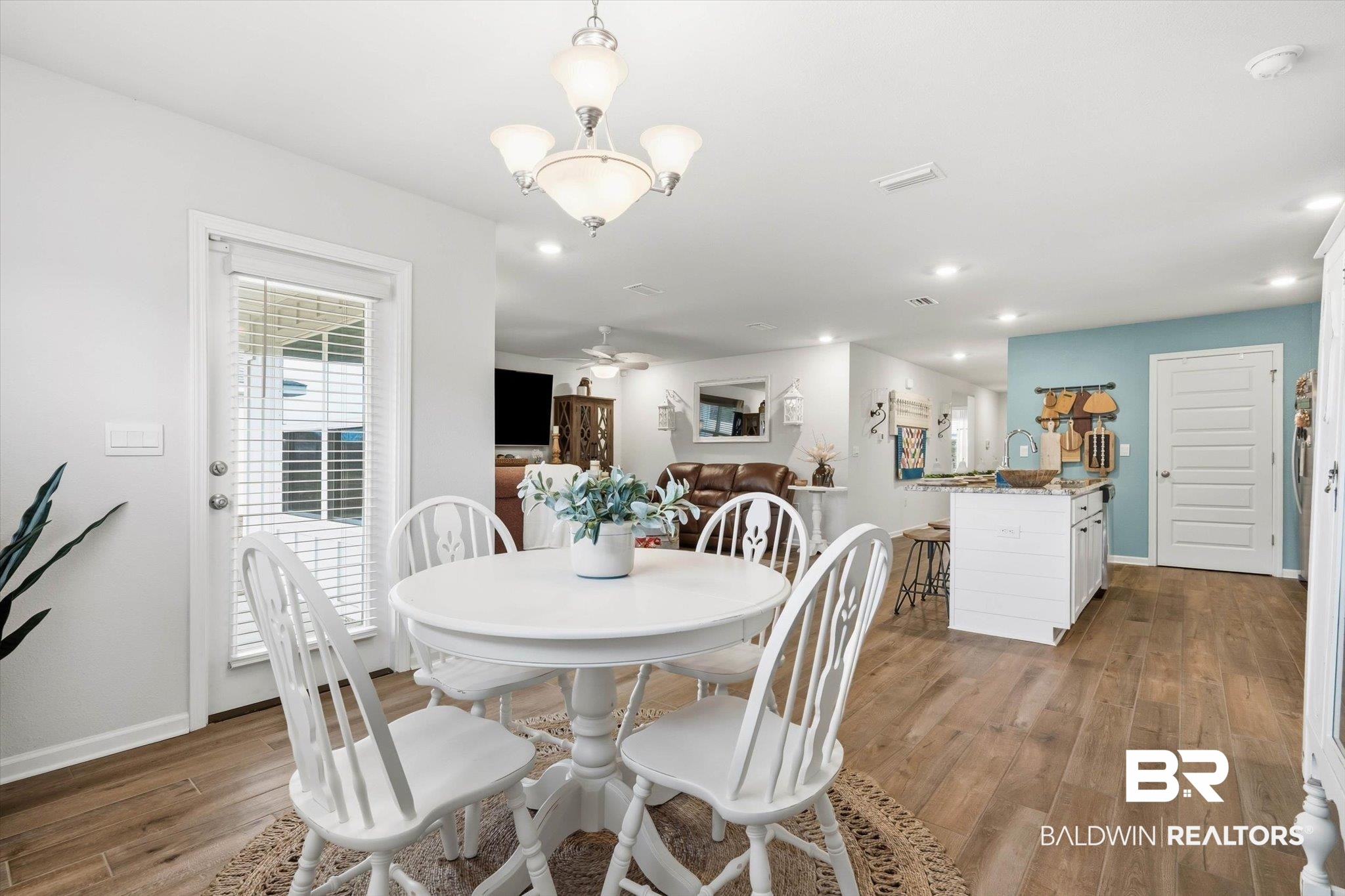 17041 Muse Street Loxley, AL 36551 - Photo 8 of 44 Dining area with wood finished floors, ceiling fan, and hanging lights