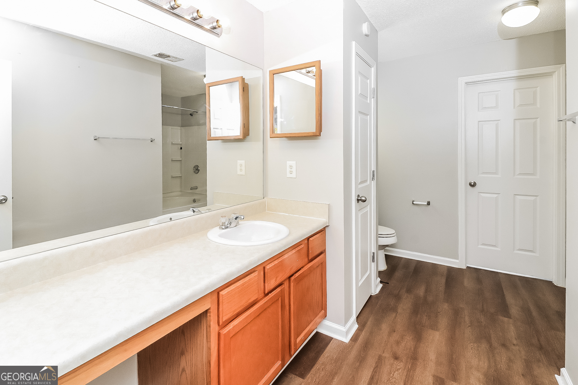 59 Greystone Ridge Hiram, GA 30141 - Photo 12 of 15 a spacious bathroom with a sink and a large mirror