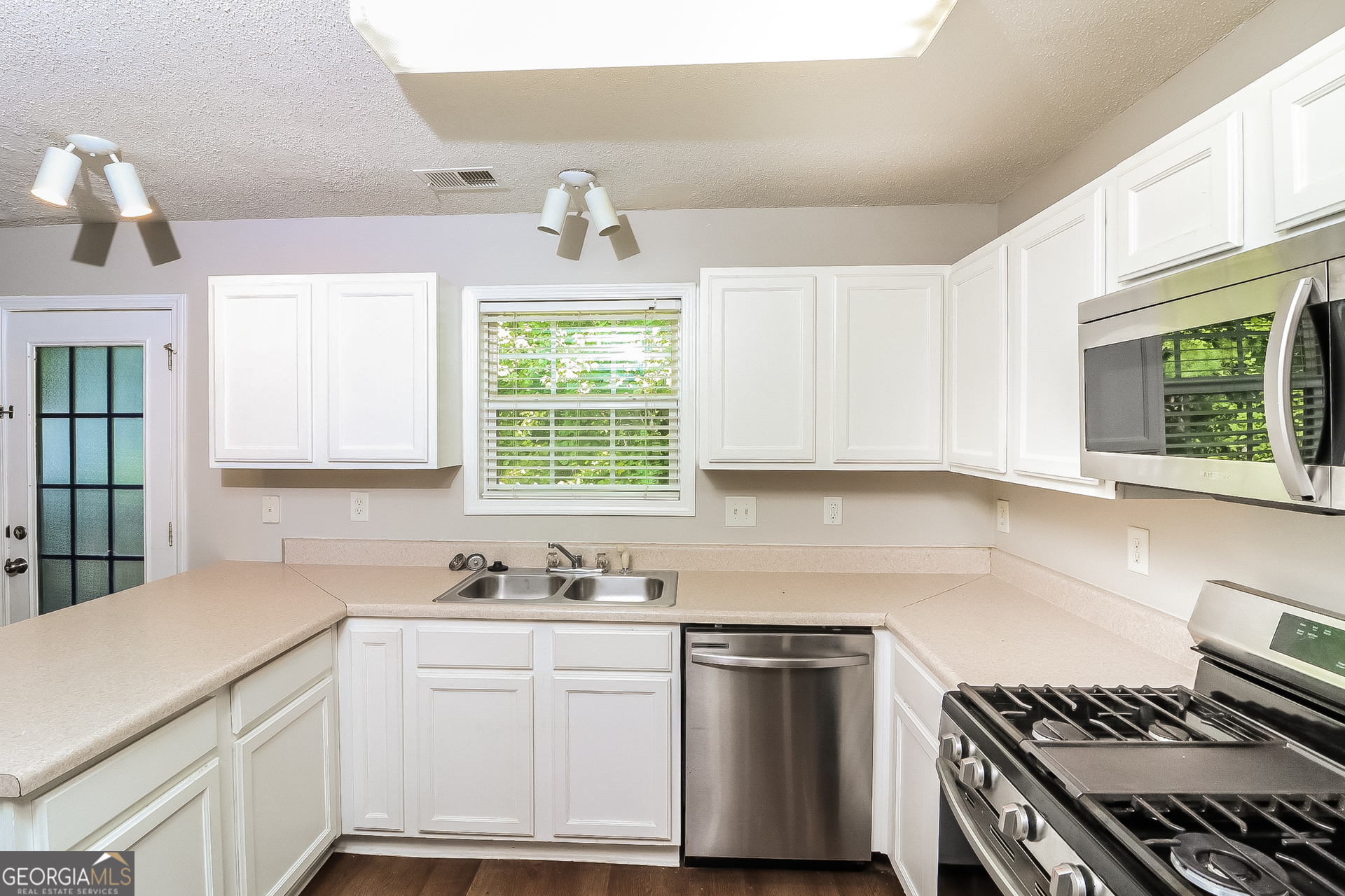 59 Greystone Ridge Hiram, GA 30141 - Photo 7 of 15 a kitchen with cabinets appliances and a window