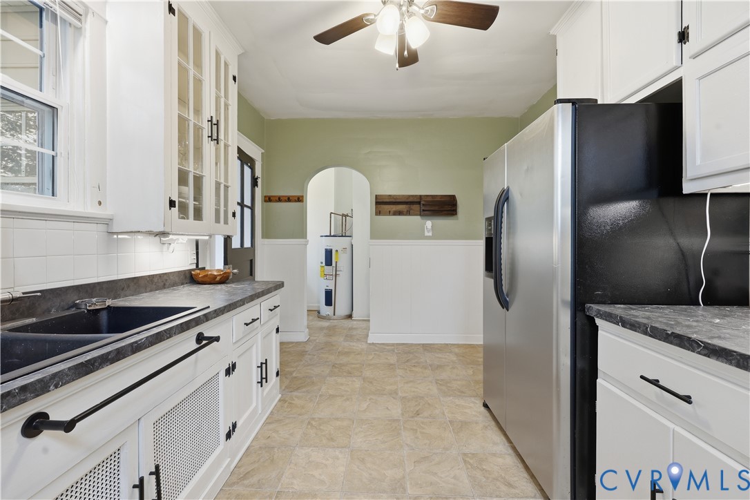 8077 Signal Hill Road Mechanicsville, VA 23111 - Photo 14 of 24 Kitchen featuring white cabinetry, dark countertop