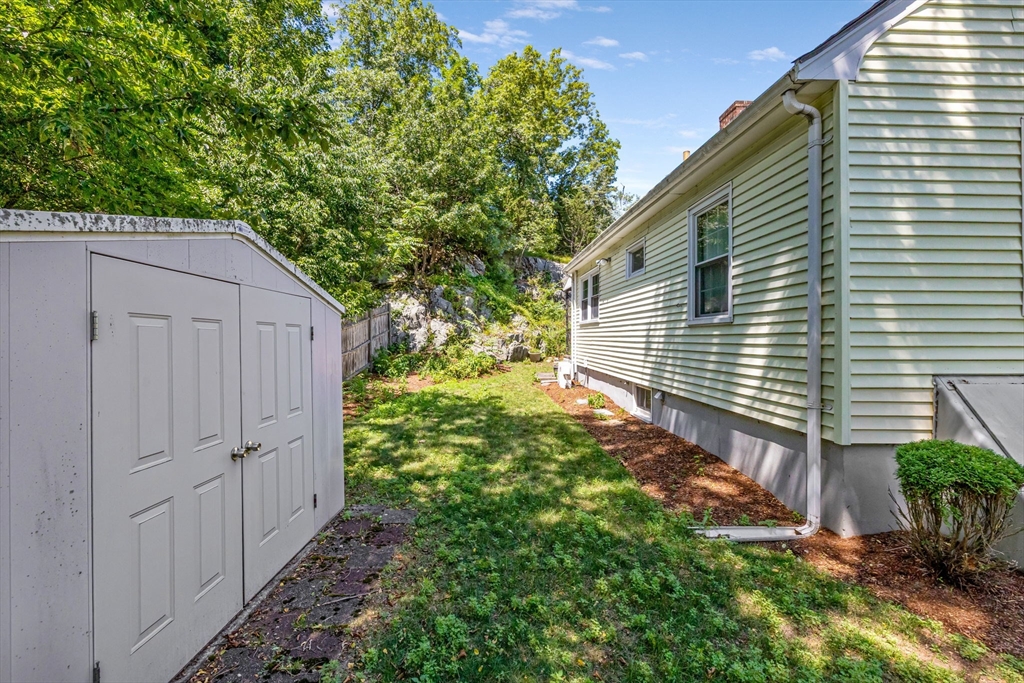 38 Cutter Hill Road Arlington, MA 02474 - Photo 19 of 23 a backyard of a house with lots of green space