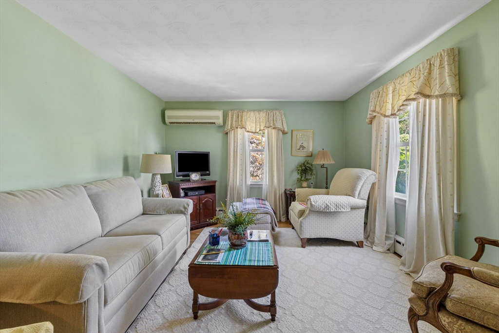 38 Cutter Hill Road Arlington, MA 02474 - Photo 4 of 23 a living room with furniture and a flat screen tv
