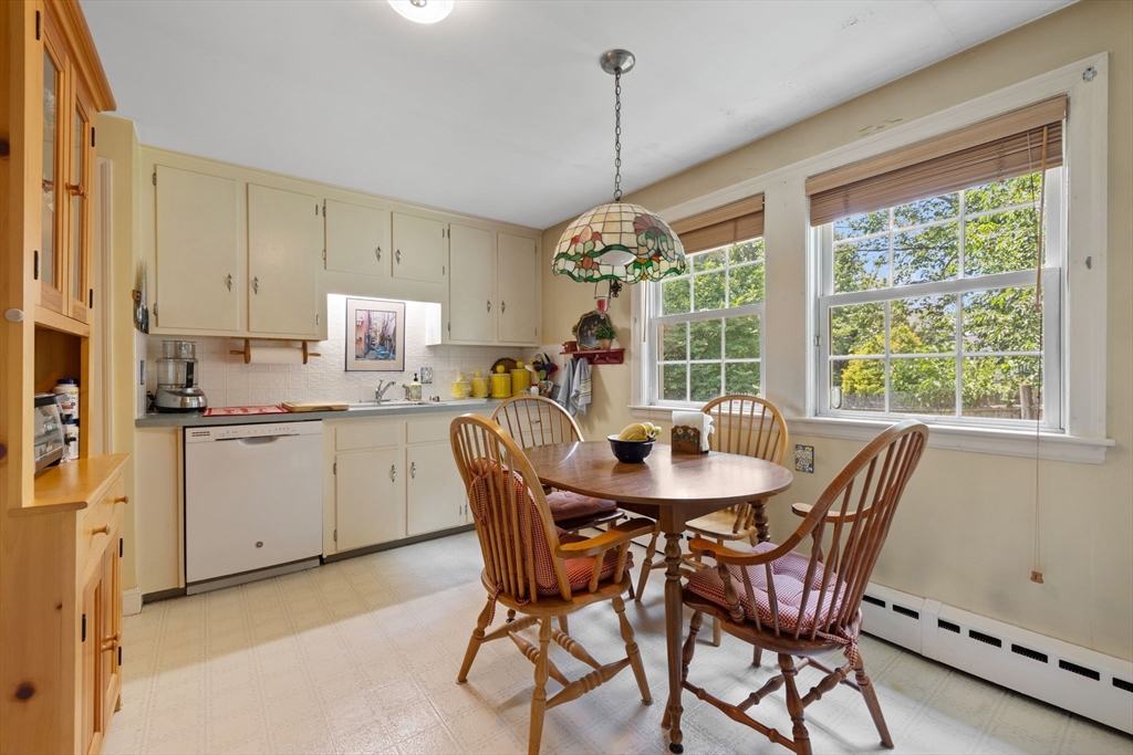 38 Cutter Hill Road Arlington, MA 02474 - Photo 5 of 23 a dining room with furniture a chandelier and window