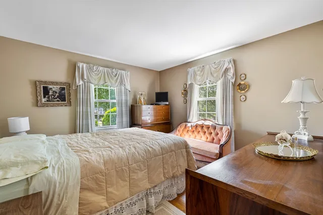 a bedroom with a bed and a table