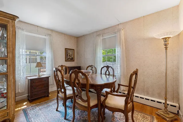 a dining room with furniture and window