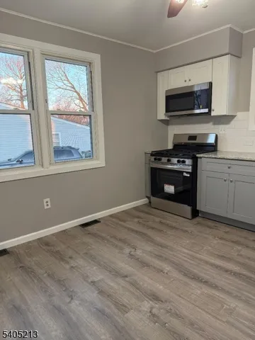 a view of kitchen and microwave