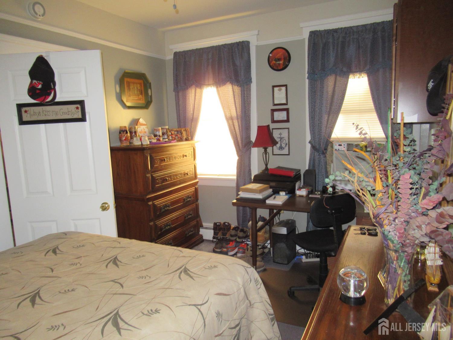 82 Pulaski Avenue Carteret, NJ 07008 - Photo 15 of 47 a bedroom with a bed and a window