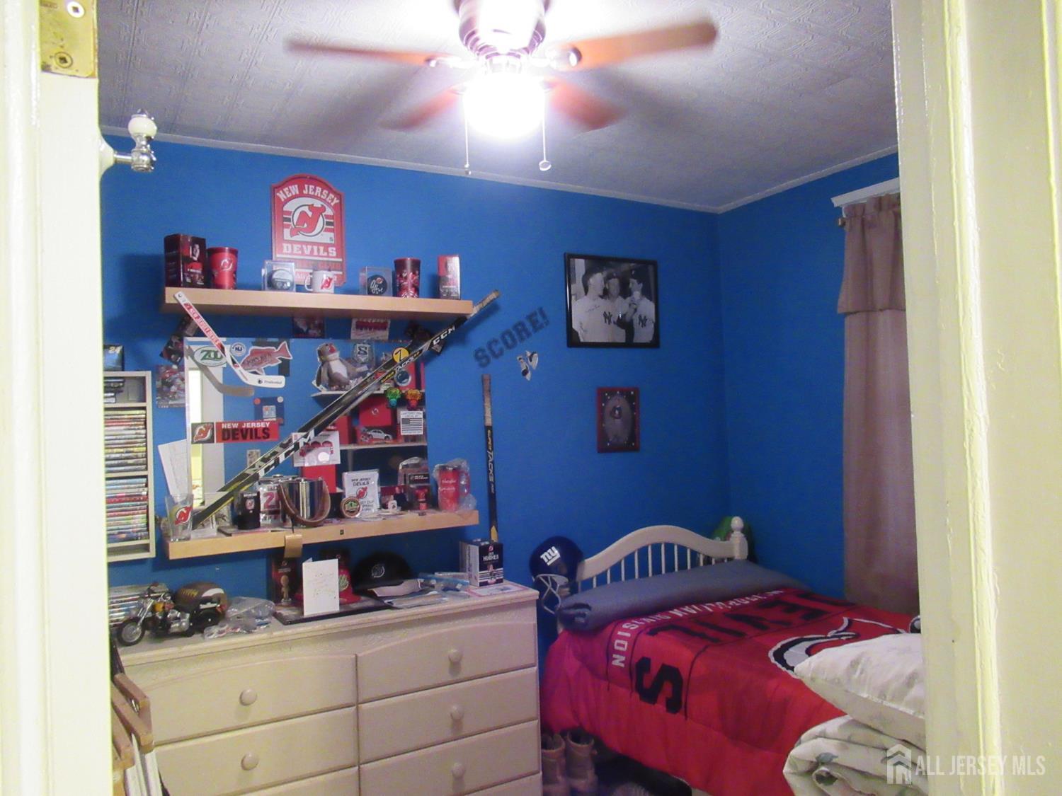 82 Pulaski Avenue Carteret, NJ 07008 - Photo 16 of 47 a bedroom with a bed and furniture