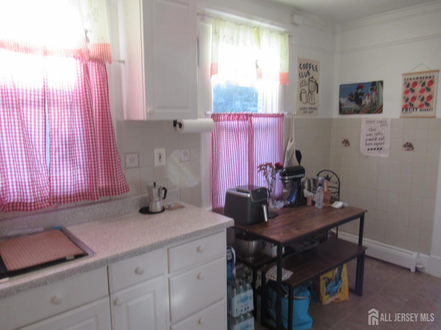 82 Pulaski Avenue Carteret, NJ 07008 - Photo 26 of 47 a kitchen with a sink cabinets and a window