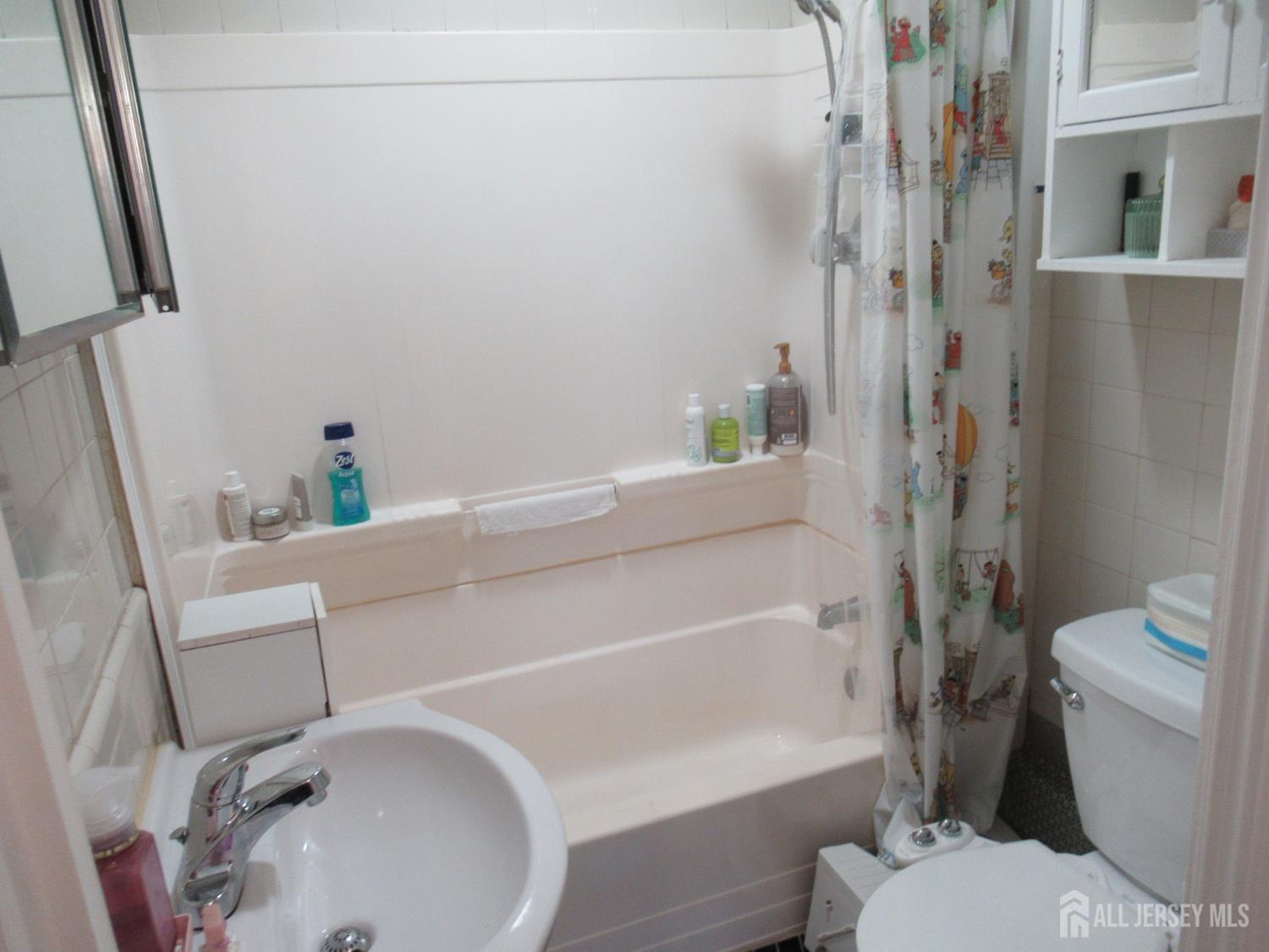 82 Pulaski Avenue Carteret, NJ 07008 - Photo 29 of 47 a bathroom with a sink and toilet