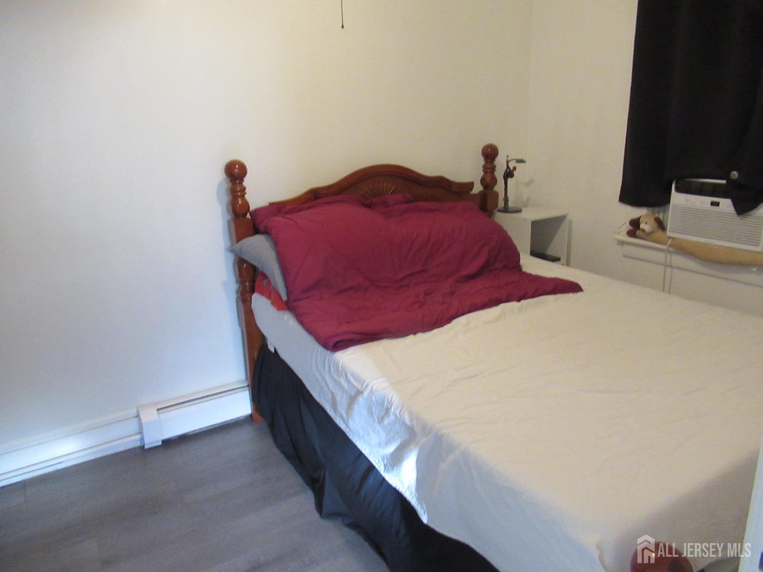 82 Pulaski Avenue Carteret, NJ 07008 - Photo 38 of 47 a bedroom with bed and a flat screen tv