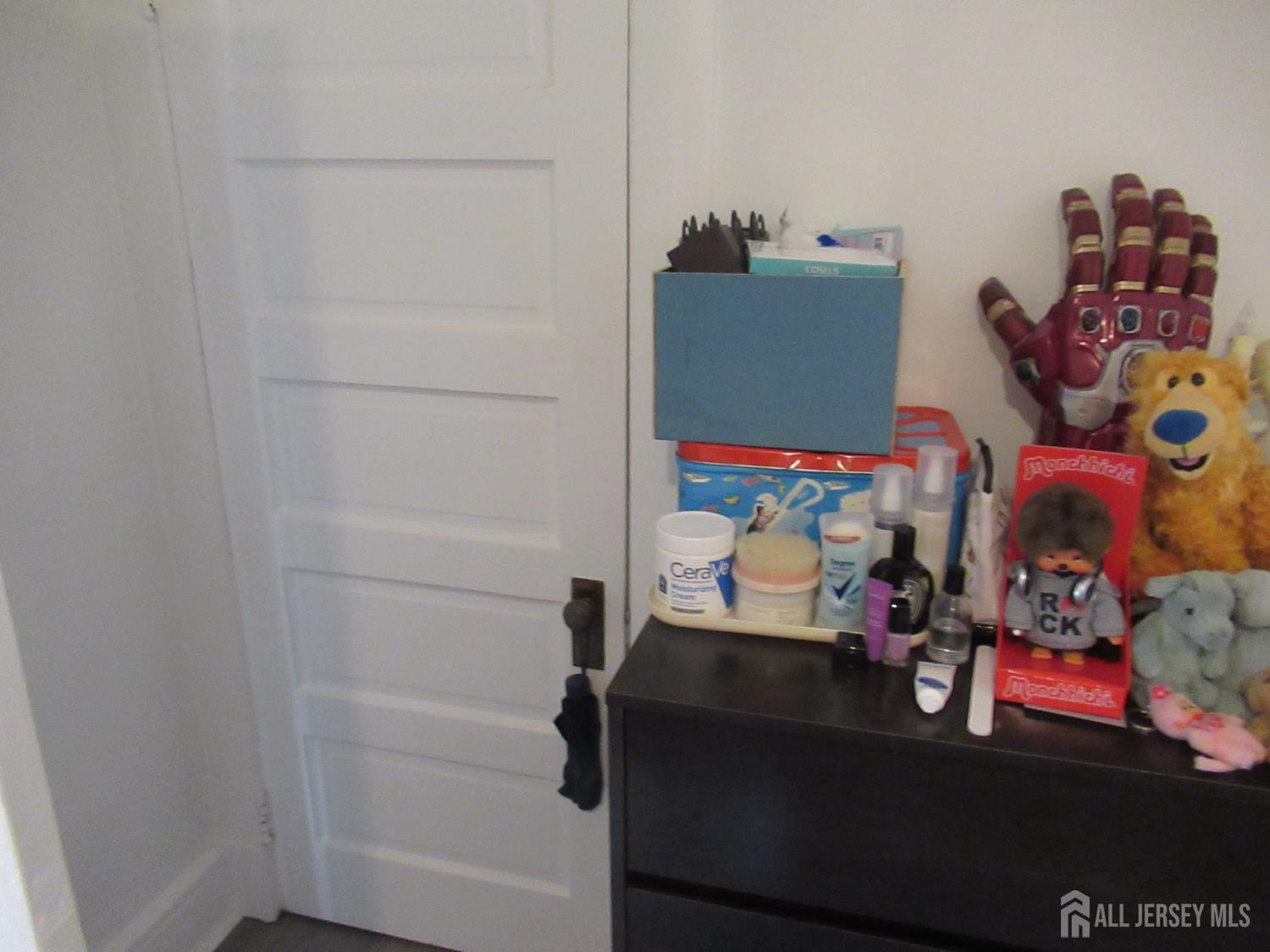 82 Pulaski Avenue Carteret, NJ 07008 - Photo 39 of 47 a room with toys and storage