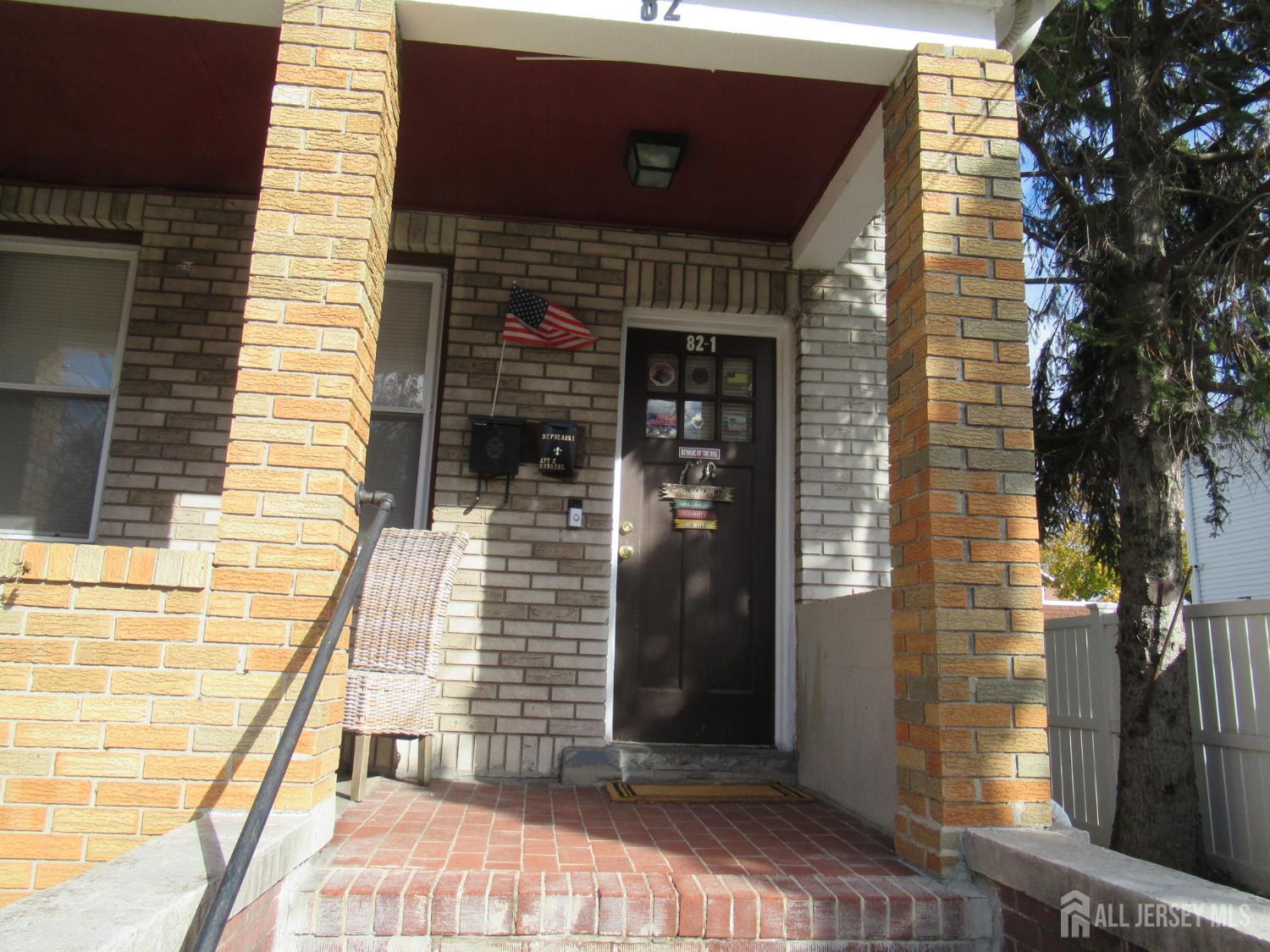 82 Pulaski Avenue Carteret, NJ 07008 - Photo 4 of 47 a front view of a house with a door