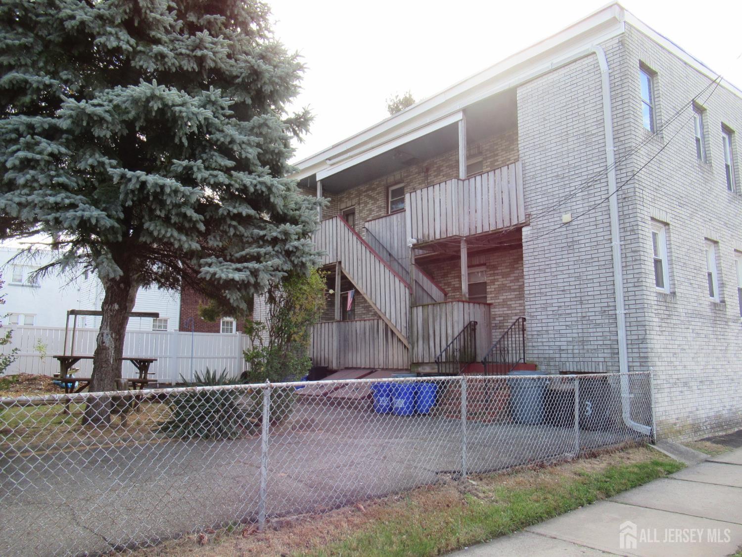 82 Pulaski Avenue Carteret, NJ 07008 - Photo 6 of 47 a view of a house with a yard