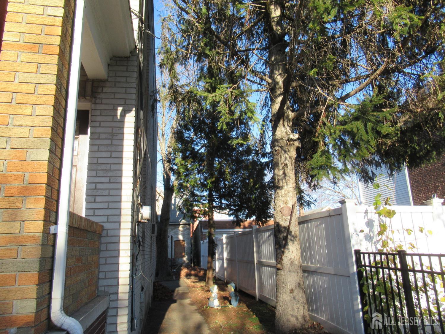 82 Pulaski Avenue Carteret, NJ 07008 - Photo 7 of 47 a view of a house with a tree