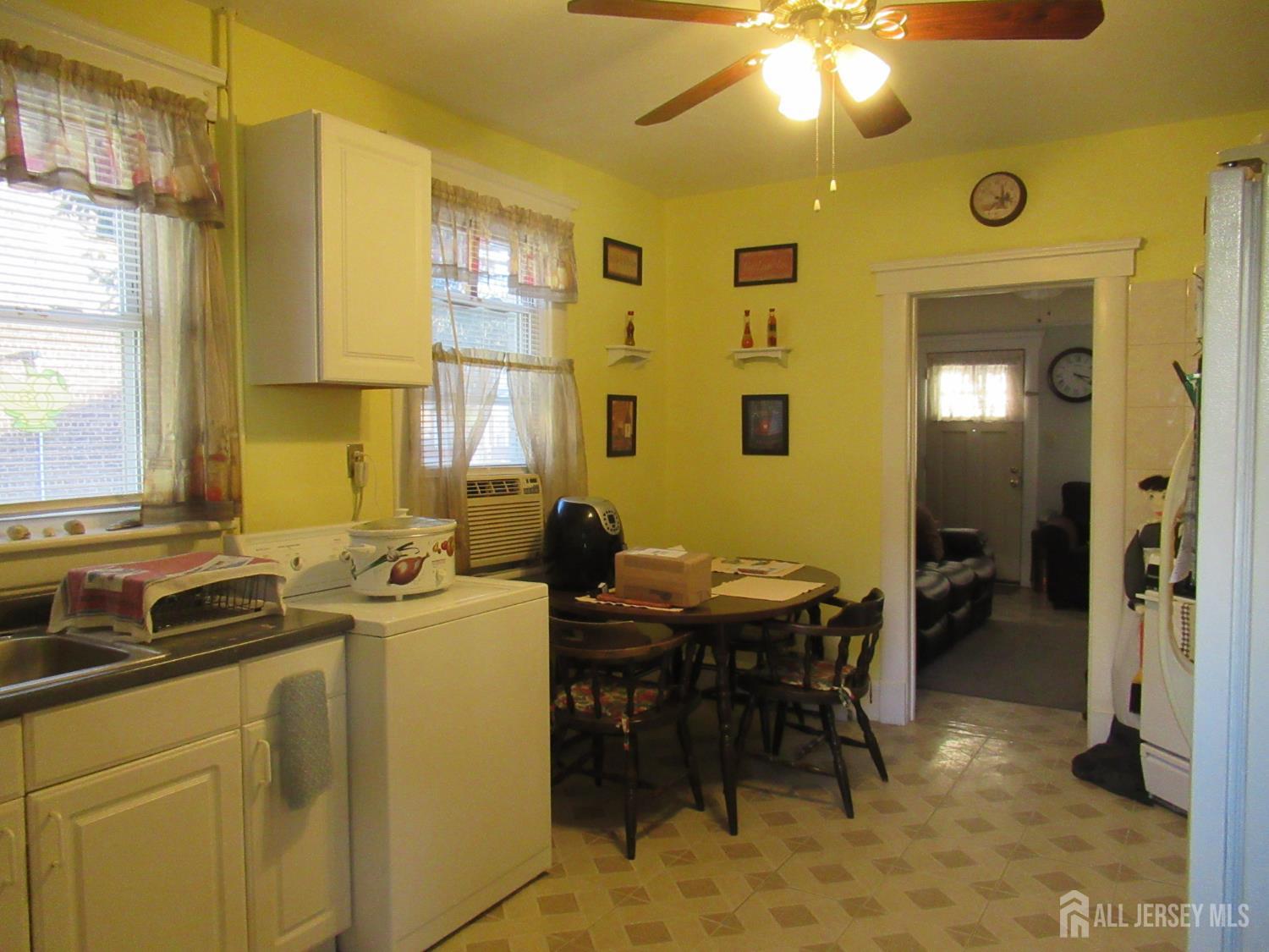 82 Pulaski Avenue Carteret, NJ 07008 - Photo 9 of 47 a view of a dining room with furniture and a chandelier