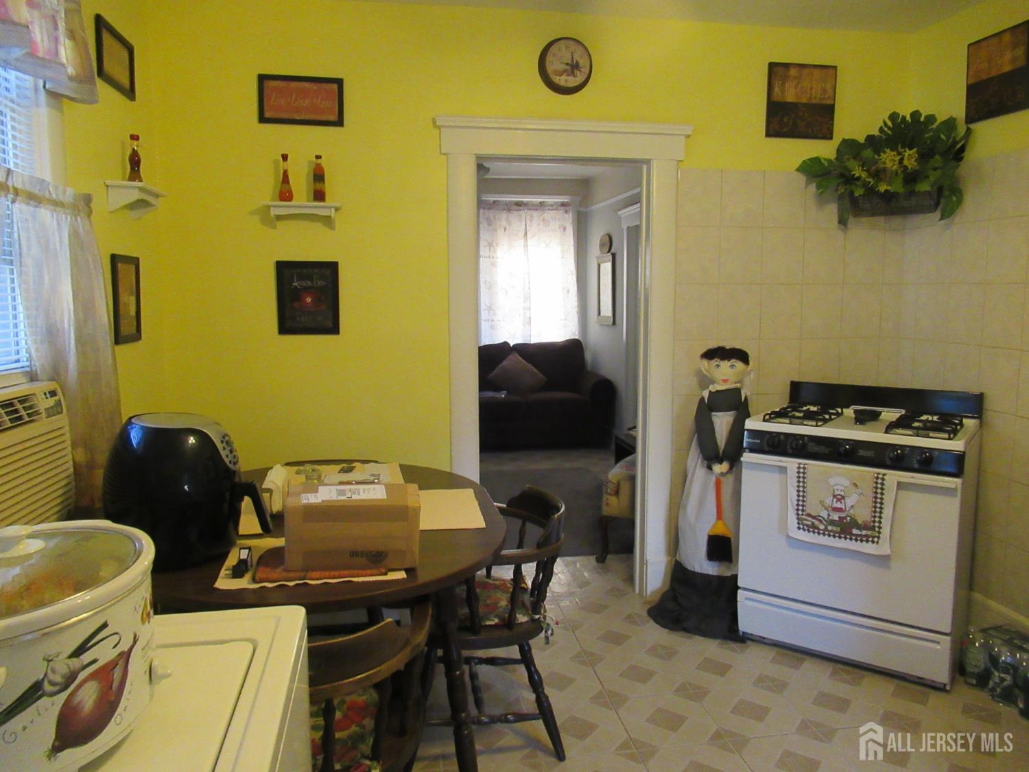 82 Pulaski Avenue Carteret, NJ 07008 - Photo 10 of 47 a workspace with furniture and a gate