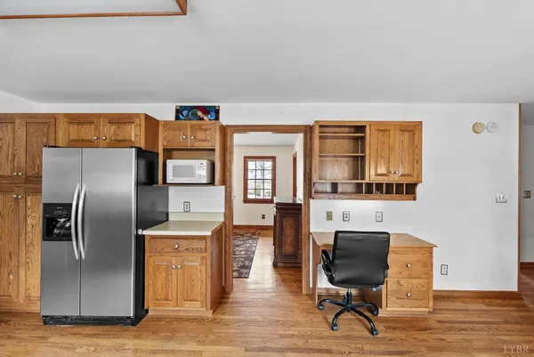 a livingroom with workspace and a couch