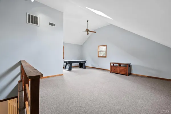 a bathroom with a toilet and shower