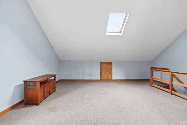 a bedroom with bed and window