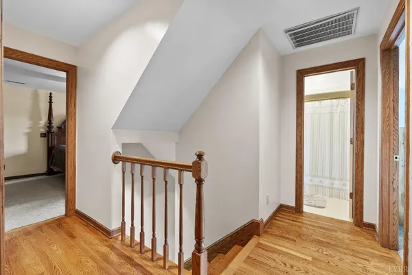 a bedroom with bed and a window