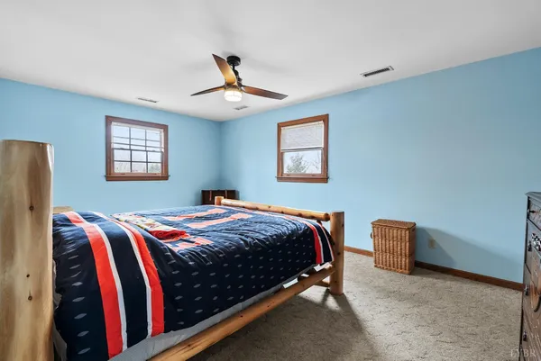a large house with a large tree in front of it