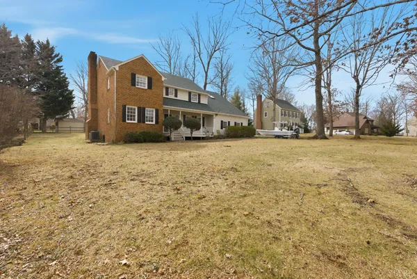 a view of a house with a snow in the yard