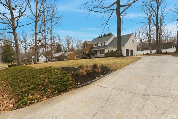 an aerial view of a house with outdoor space