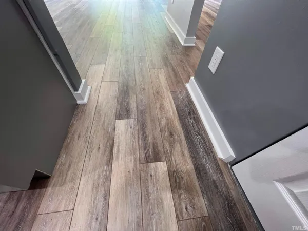 a view of front door with wooden floor