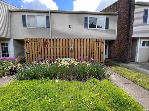a view of a patio with table and chairs potted plants with wooden floor