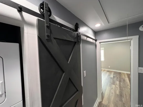 a view of a patio with table and chairs potted plants with wooden floor