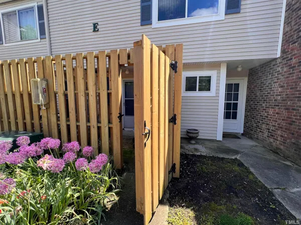 a bathroom with a granite countertop sink toilet a mirror and vanity